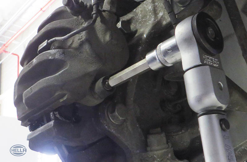 Mount the brake caliper